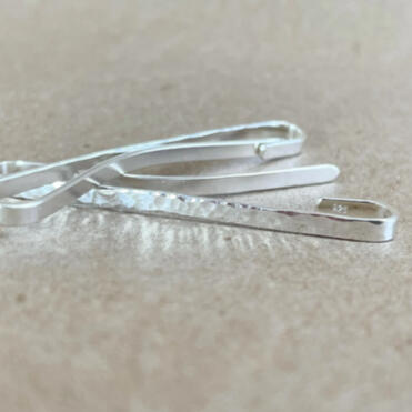 hand-crafted silver barrettes.